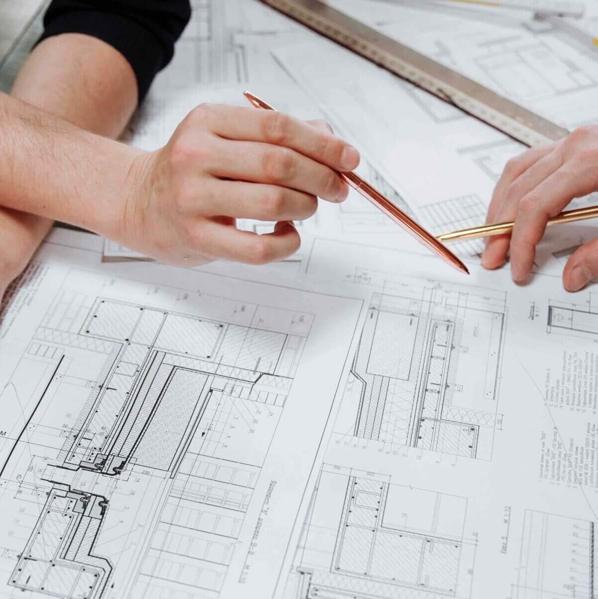 photo of two people discussing a building design